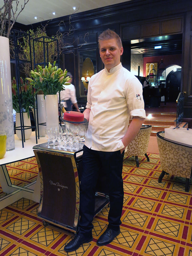 Chef Patissier Ian Baker with one of his cakes, and champagne