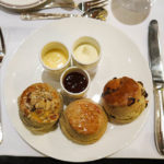 Lemon curd, clotted cream, fruit jam with scones, all made from scratch, at Hotel Four Seasons Munich